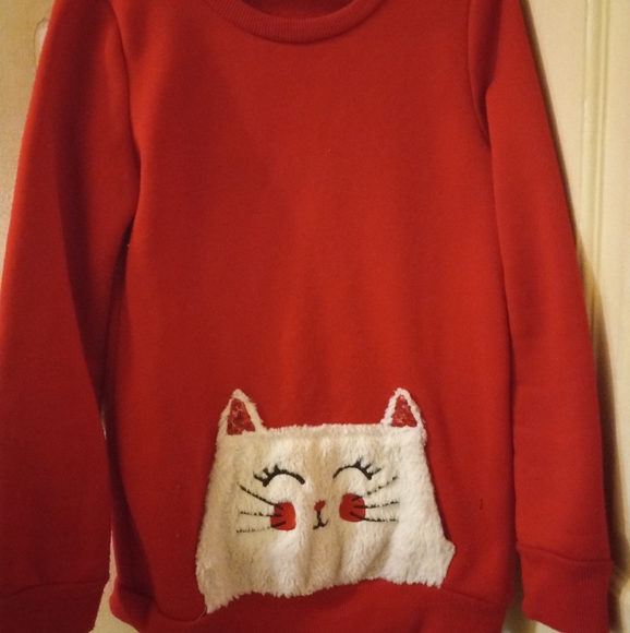 I am selling a red sweater and apart the matching - Picture 2 of 3